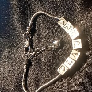 Laurn snake chain bracelet block letters. 7.5 - 9 in long extendable